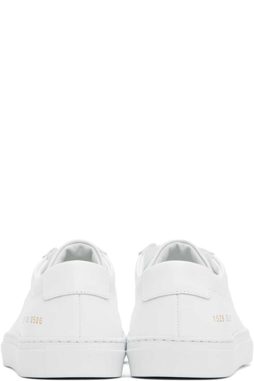 Low-top buffed leather sneakers in white.

· Lace-up closure
· Padded tongue and collar
· Signature series stamp at outer side
· Buffed leather and suede lining
· Treaded rubber sole

Supplier color: White