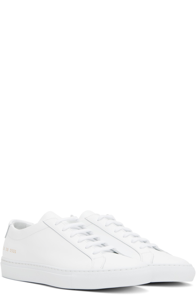 Low-top buffed leather sneakers in white.

· Lace-up closure
· Padded tongue and collar
· Signature series stamp at outer side
· Buffed leather and suede lining
· Treaded rubber sole

Supplier color: White