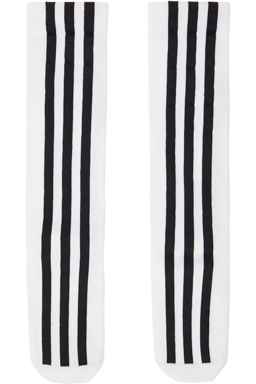 Pair of knit stretch cotton- and recycled nylon-blend socks in white.

· Signature stripes at face
· Logo embroidered at back cuffs

Supplier color: White