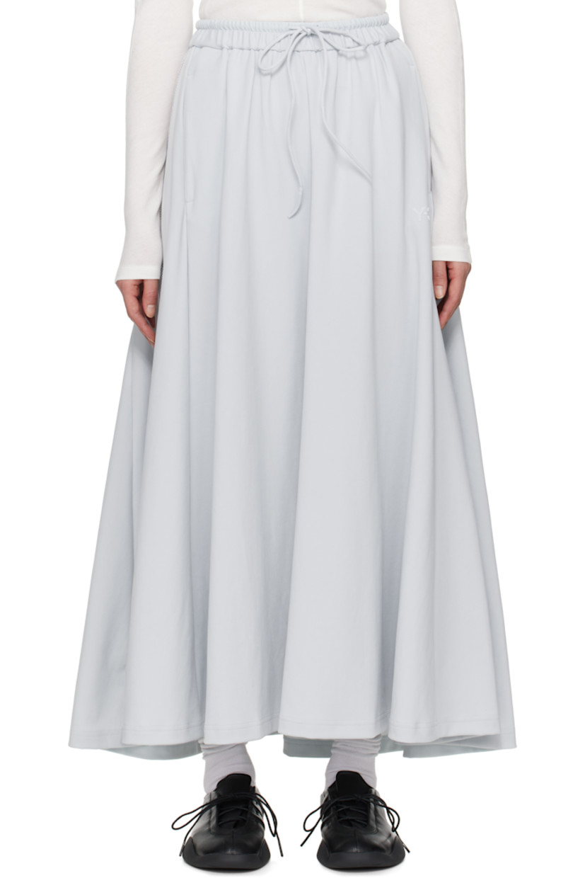 Loose-fit nylon jersey maxi skirt. 

· Drawstring at elasticized waistband
· Two-pocket styling
· Logo bonded at front
· Sheer mesh stripes at side seam

Supplier color: Grey