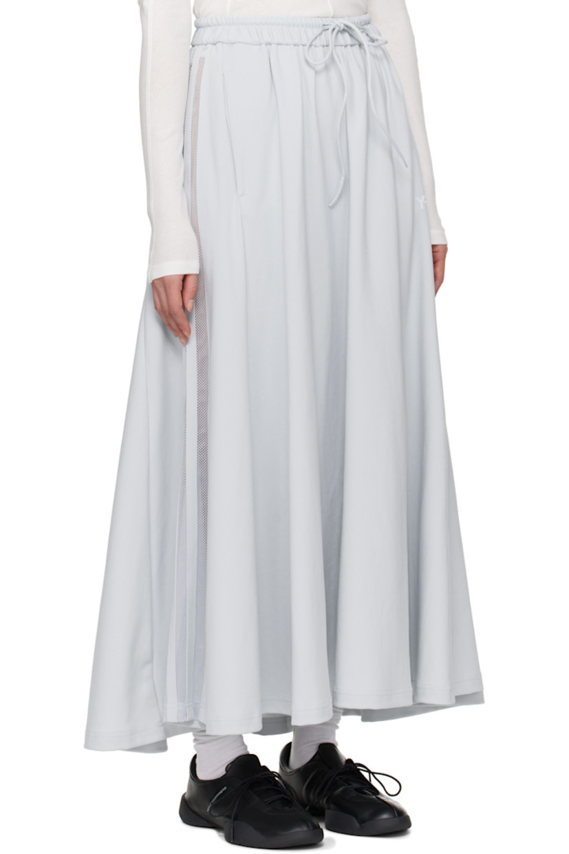 Loose-fit nylon jersey maxi skirt. 

· Drawstring at elasticized waistband
· Two-pocket styling
· Logo bonded at front
· Sheer mesh stripes at side seam

Supplier color: Grey