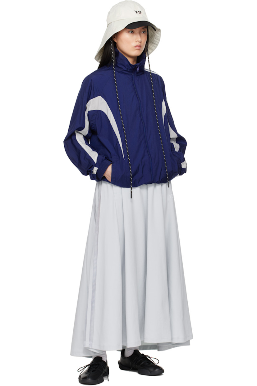 Loose-fit nylon jersey maxi skirt. 

· Drawstring at elasticized waistband
· Two-pocket styling
· Logo bonded at front
· Sheer mesh stripes at side seam

Supplier color: Grey