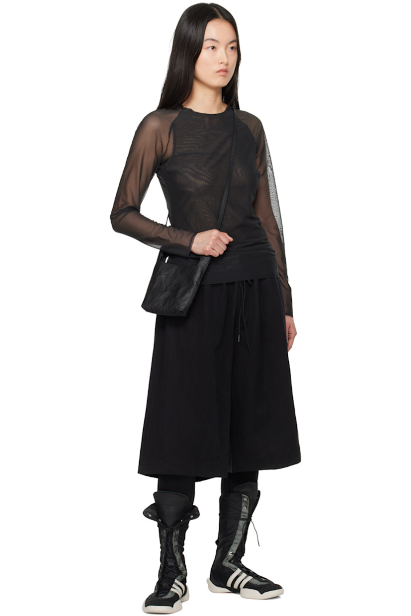 Slim-fit stretch recycled polyester mesh T-shirt.

· Layered construction
· Crewneck 
· Elasticized hem and cuffs
· Vent at side seams

Supplier color: Black