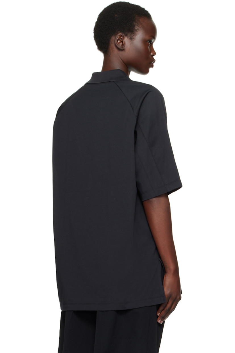 Cotton- and recycled-polyester blend jersey polo. 

· Paneled construction
· Spread collar at rib-knit V-neck
· Raglan sleeves
· Stripes and logo flag at sleeve

Supplier color: Black