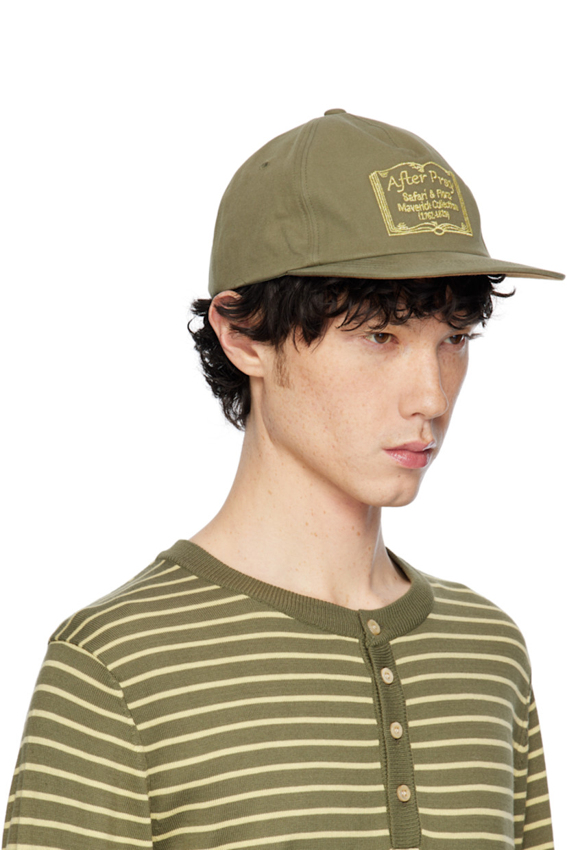 Cotton twill cap in khaki. 

· Embroidered eyelets at crown
· Logo graphic embroidered at face and back face
· Flat brim
· Cinch fastening
· Cotton twill browband
· Felt lining at inner brim

Supplier color: Khaki
