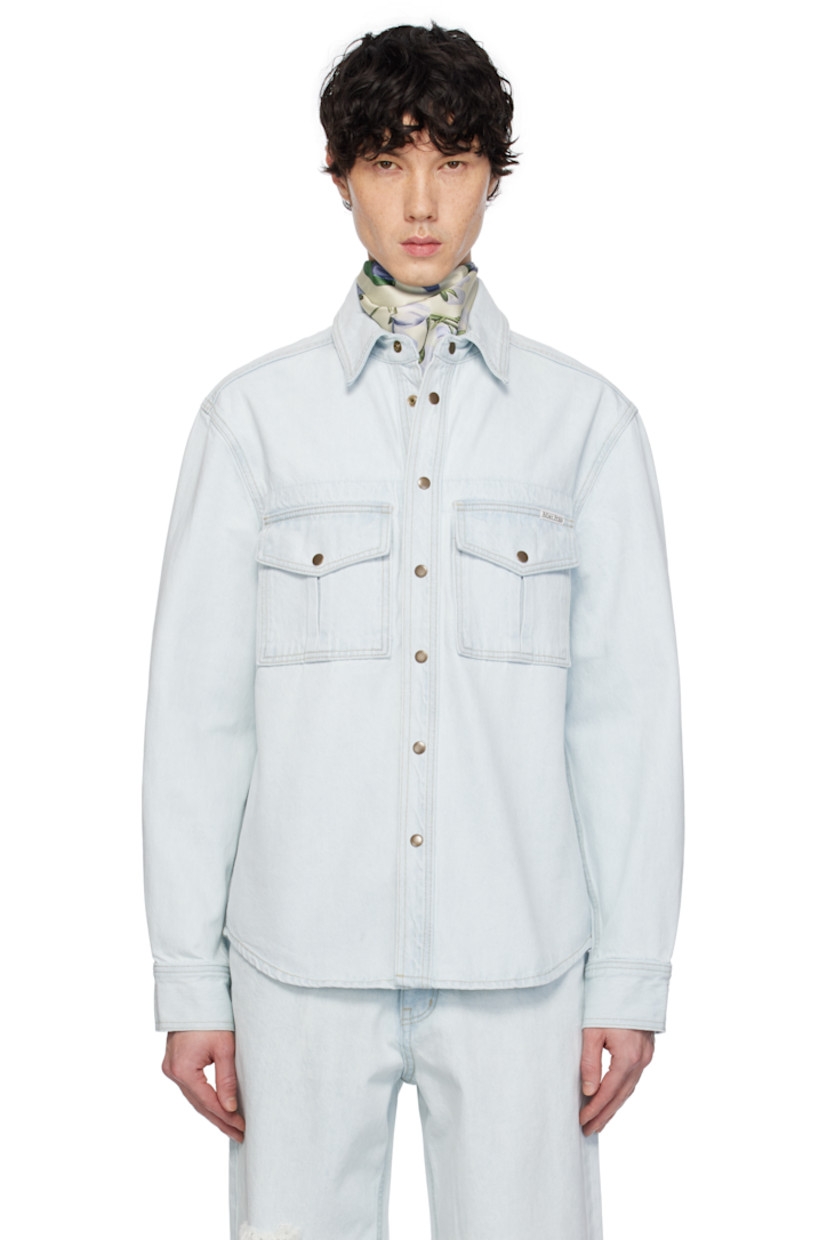 Non-stretch denim jacket. Fading throughout.

· Spread collar
· Press-stud closure
· Flap pockets
· Logo patch at chest
· Shirttail hem
· Press-stud barrel cuffs
· Contrast stitching in yellow

Supplier color: Light indigo