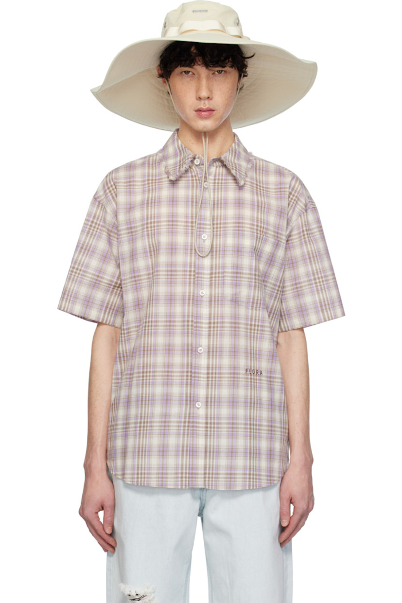 Cotton poplin shirt. Check pattern throughout.

· Fringed edge at spread collar
· Button closure
· Text embroidered at front
· Shirttail hem
· Box pleat at back yoke
· Partial poplin lining

Supplier color: Lavender