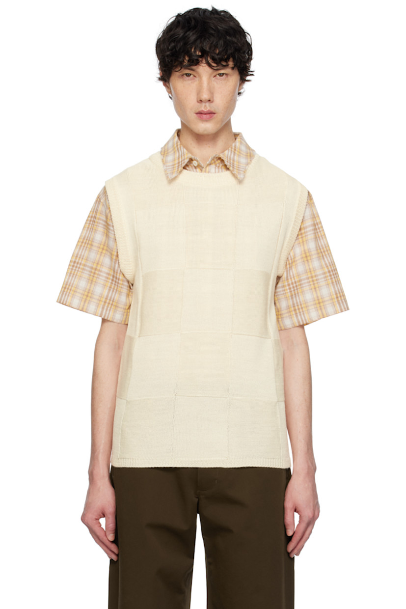 Purl-knit and knit wool-blend vest.

· Rib-knit crewneck, hem, and armscyes
· Logo plaque at back collar

Supplier color: Ivory