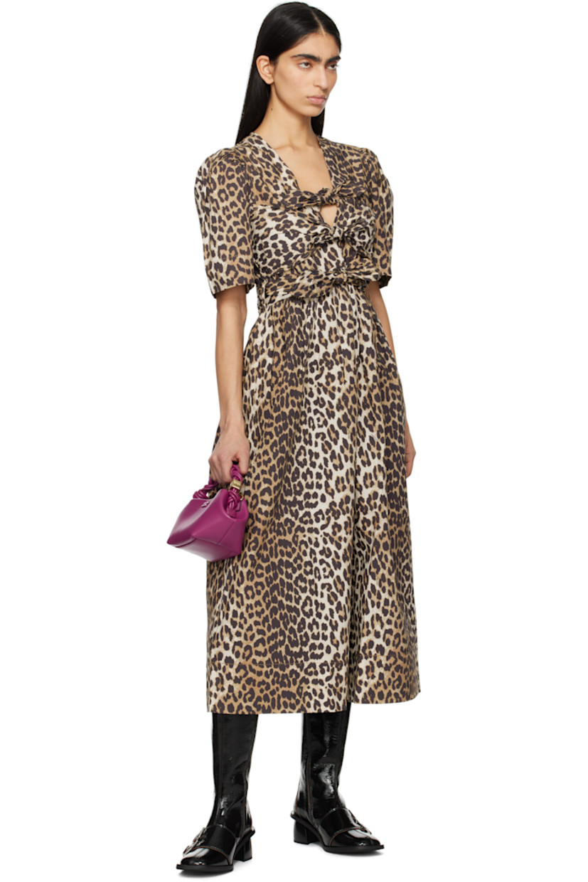 Organic cotton poplin midi dress. Leopard and logo pattern printed throughout.

· Self-tie fastenings at plunging V-neck
· Gathering at waist and shoulders
· Detachable self-tie belt and belt loops
· Seam pockets

Supplier color: Leopard