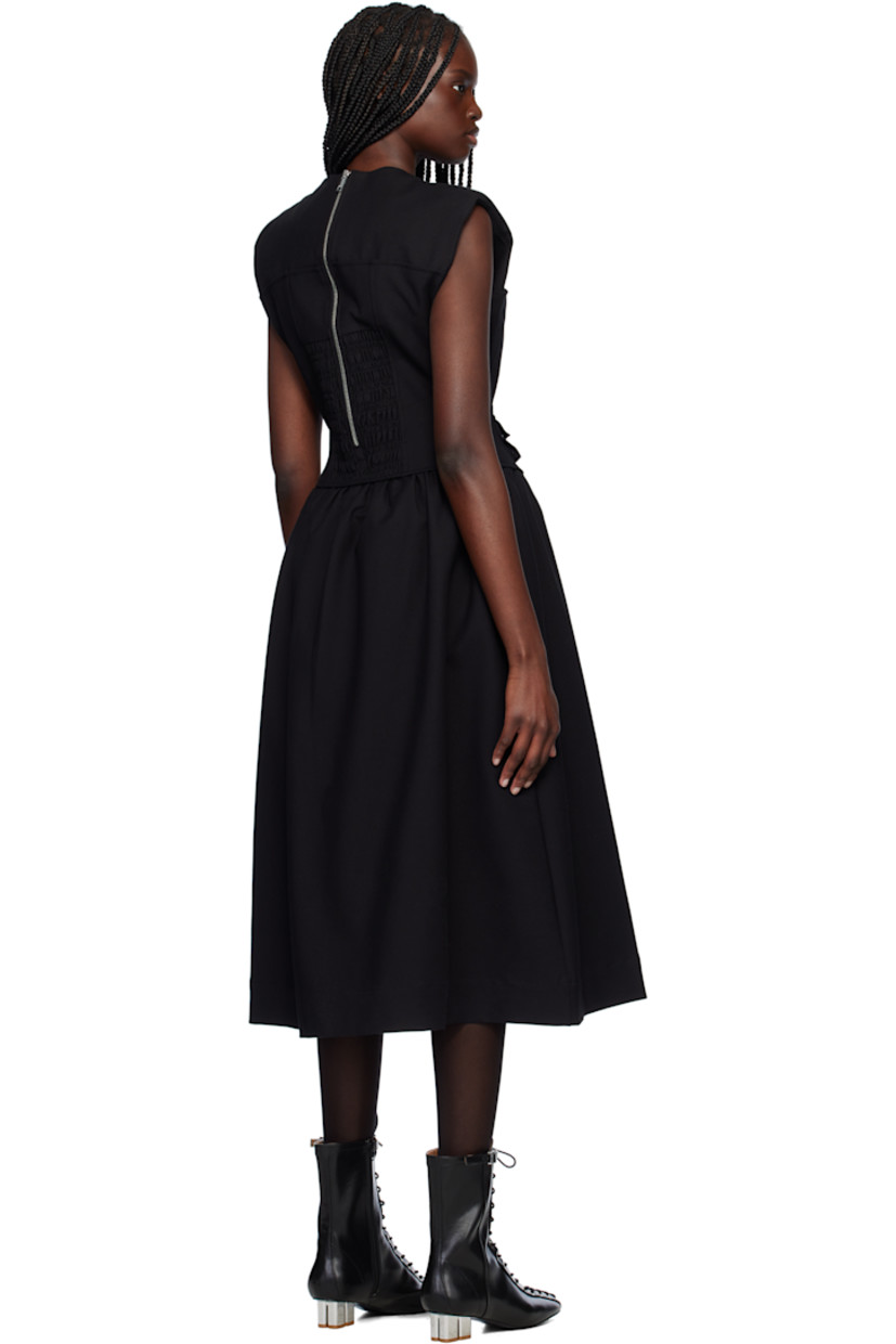 Heavyweight plain-woven stretch organic cotton midi dress. 

· Round neck
· Princess seams at front
· Flap pocket and detachable flap pocket at waist
· Padded shoulders
· Zip closure and shirring at back
· Full logo-woven satin lining
· Logo-engraved silver-tone hardware

Supplier color: Black