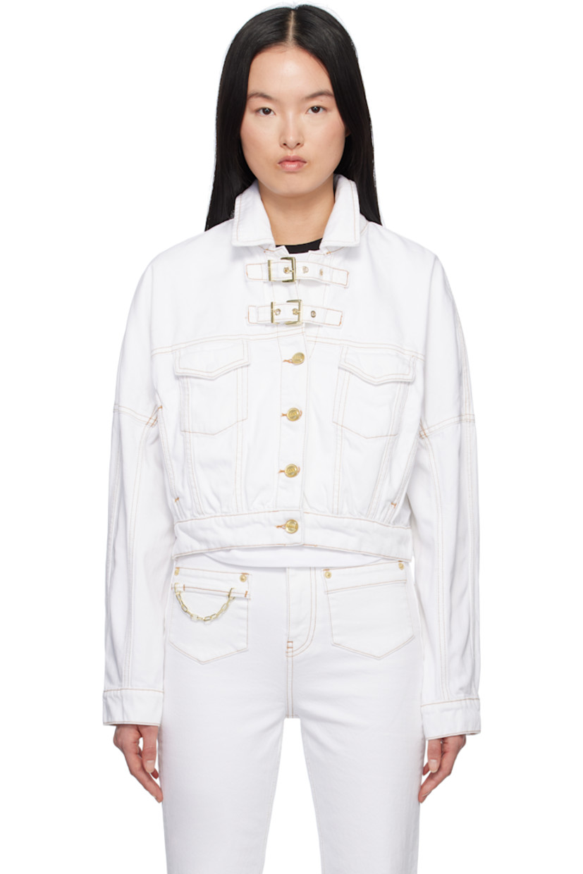 Non-stretch organic cotton denim jacket.

· Spread collar
· Pin-buckle tabs at button closure
· Flap pockets
· Single-button barrel cuffs
· Logo patch at back hem
· Adjustable button tabs at back hem
· Contrast stitching in tan

Supplier color: Bright white