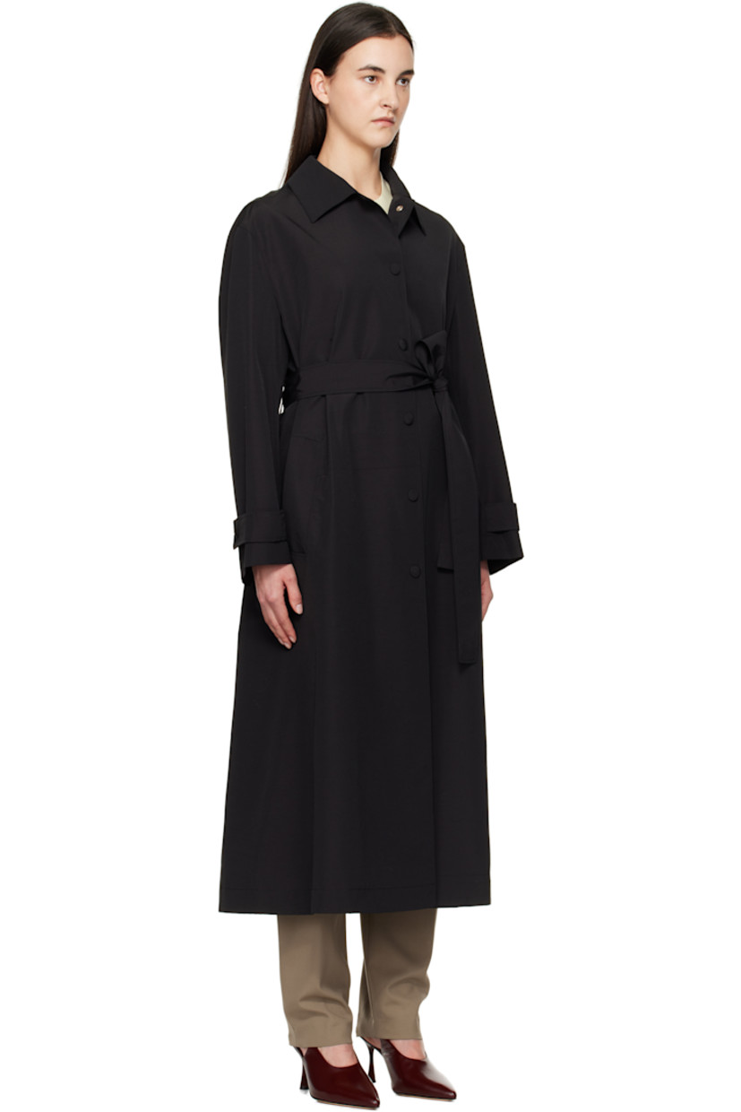 Oversized virgin wool- and nylon-blend faille trench coat. 

· Spread collar
· Press-stud closure
· Belt loops and detachable self-tie belt
· Welt pockets
· Dropped shoulders
· Adjustable press-stud tab at cuffs
· Central vent at back hem 
· Full viscose twill lining

Supplier color: Black