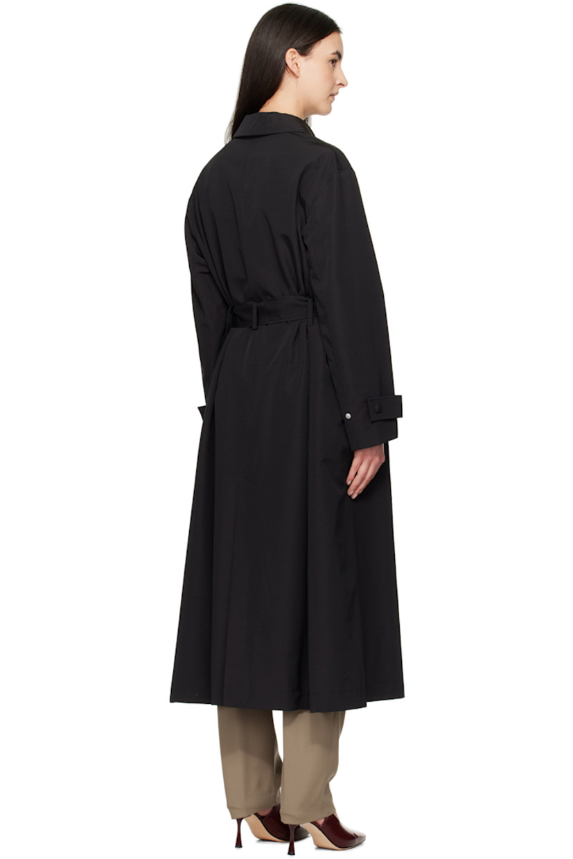 Oversized virgin wool- and nylon-blend faille trench coat. 

· Spread collar
· Press-stud closure
· Belt loops and detachable self-tie belt
· Welt pockets
· Dropped shoulders
· Adjustable press-stud tab at cuffs
· Central vent at back hem 
· Full viscose twill lining

Supplier color: Black
