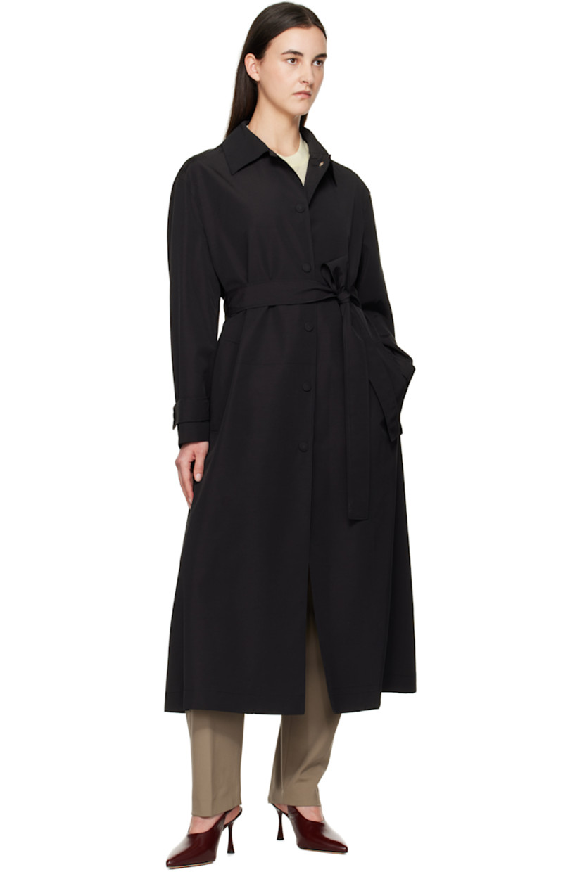 Oversized virgin wool- and nylon-blend faille trench coat. 

· Spread collar
· Press-stud closure
· Belt loops and detachable self-tie belt
· Welt pockets
· Dropped shoulders
· Adjustable press-stud tab at cuffs
· Central vent at back hem 
· Full viscose twill lining

Supplier color: Black