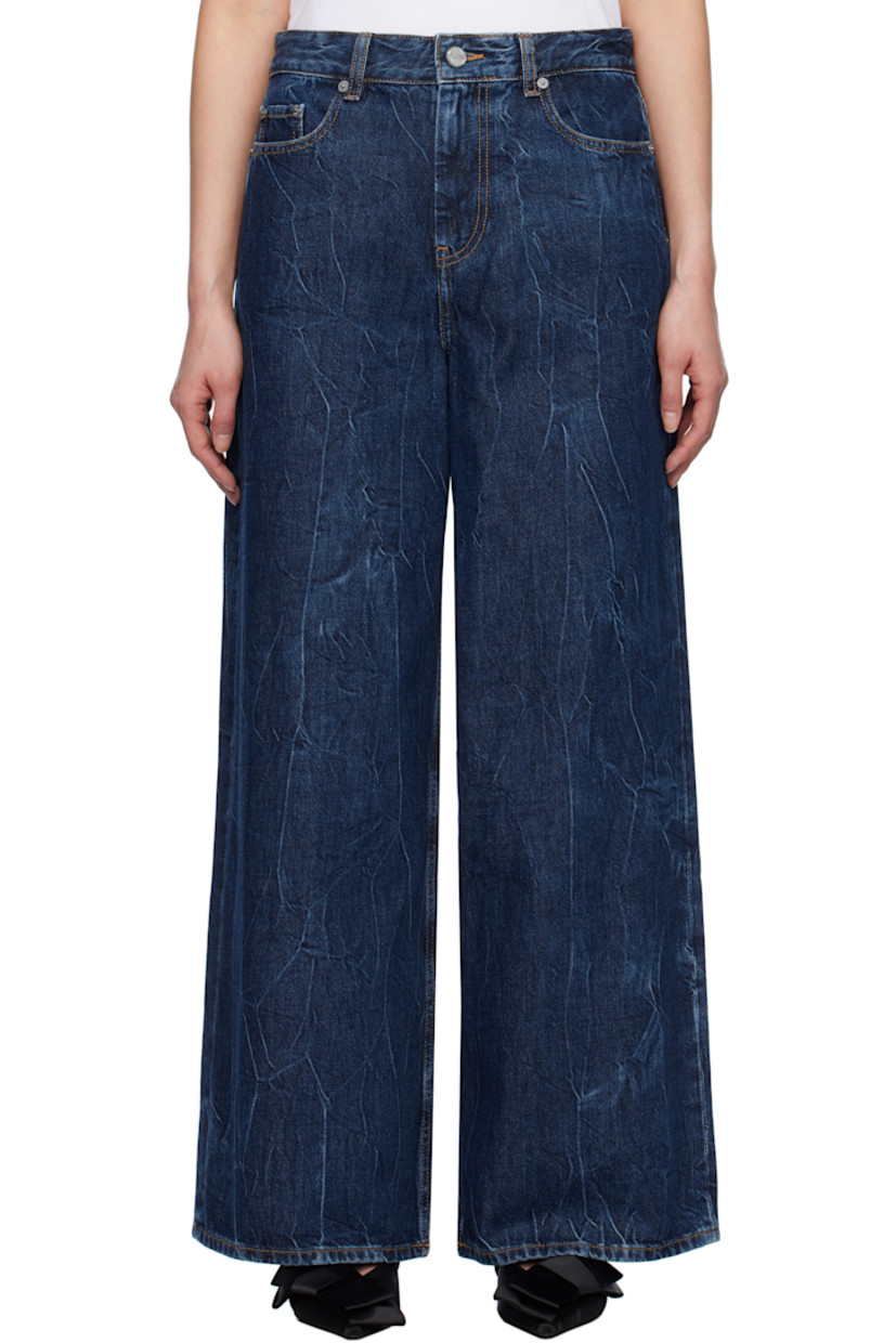 Non-stretch organic cotton- and viscose-blend denim jeans. Fading and crinkled pattern throughout.

· Belt loops
· Five-pocket styling
· Zip-fly
· Logo patch at back pocket
· Contrast stitching in tan

Supplier color: Mid blue stone