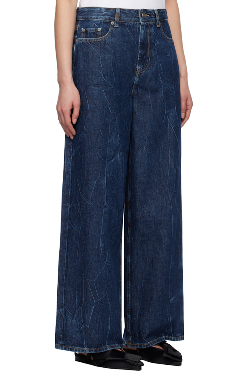 Non-stretch organic cotton- and viscose-blend denim jeans. Fading and crinkled pattern throughout.

· Belt loops
· Five-pocket styling
· Zip-fly
· Logo patch at back pocket
· Contrast stitching in tan

Supplier color: Mid blue stone