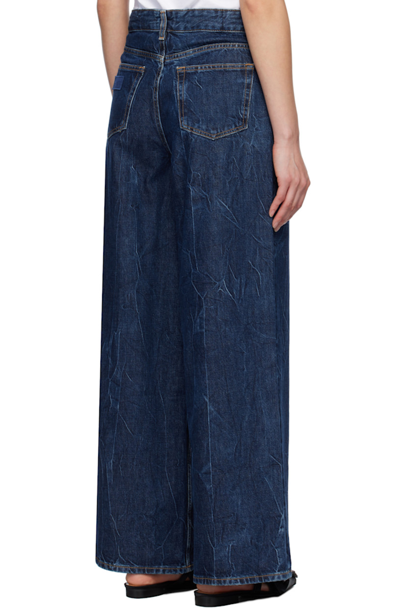 Non-stretch organic cotton- and viscose-blend denim jeans. Fading and crinkled pattern throughout.

· Belt loops
· Five-pocket styling
· Zip-fly
· Logo patch at back pocket
· Contrast stitching in tan

Supplier color: Mid blue stone