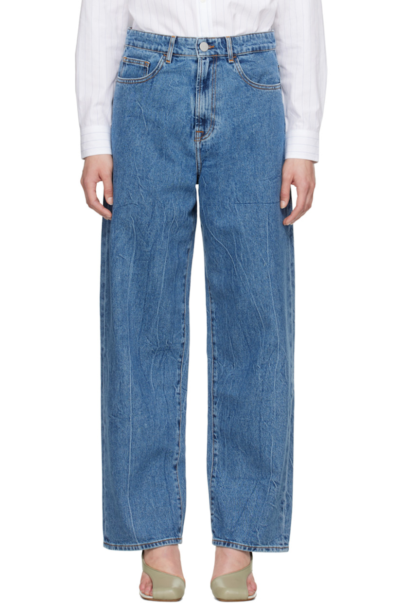 Loose-fit and wide-leg non-stretch denim jeans. Fading and whiskering throughout. 

· Low-rise
· Belt loops
· Five-pocket styling
· Zip fly
· Logo-engraved silver-tone hardware
· Contrast stitching in tan

Supplier color: Mid denim blue