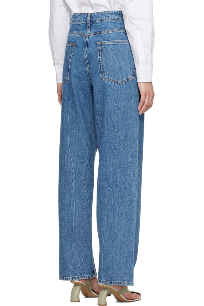 Loose-fit and wide-leg non-stretch denim jeans. Fading and whiskering throughout. 

· Low-rise
· Belt loops
· Five-pocket styling
· Zip fly
· Logo-engraved silver-tone hardware
· Contrast stitching in tan

Supplier color: Mid denim blue