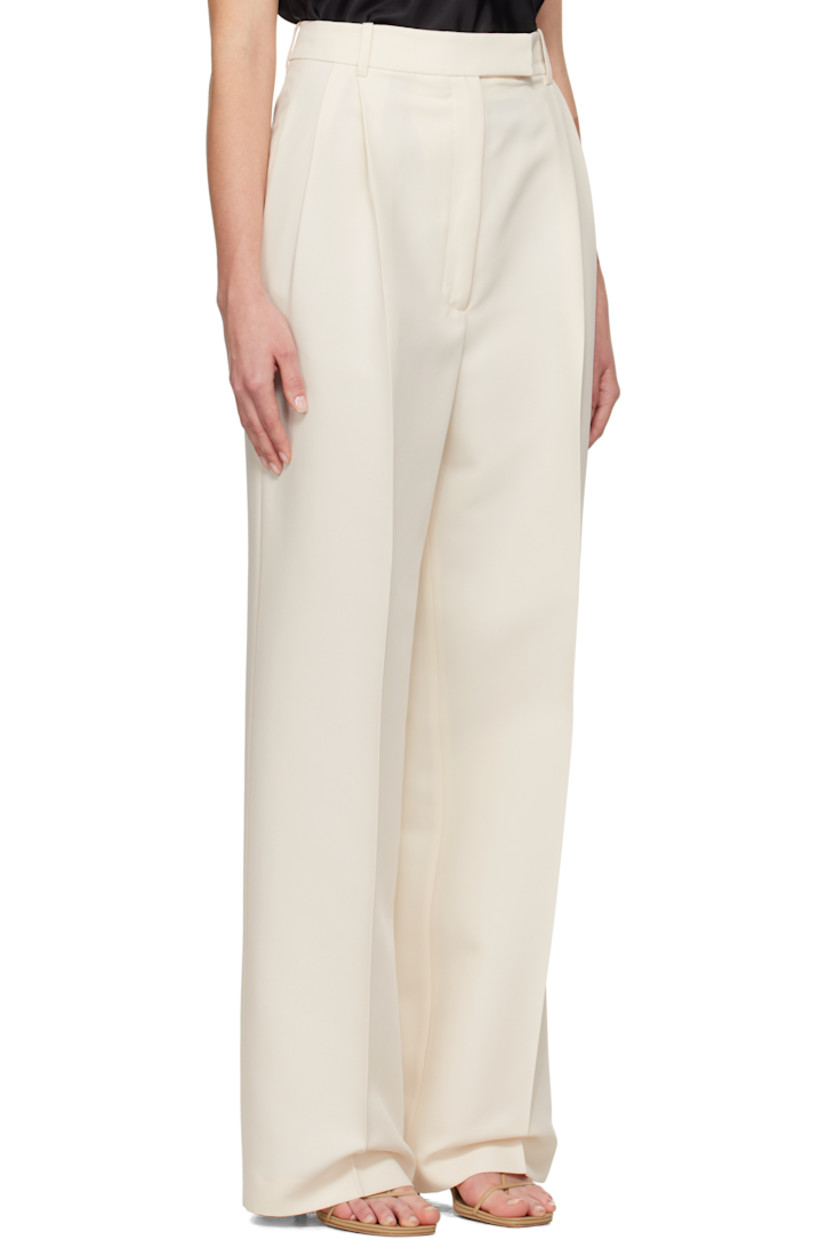 Wide-leg recycled polyester twill trousers. 

· High-rise 
· Belt loops
· Four-pocket styling
· Zip-fly
· Pleats at front
· Creased legs
· Darts at back waistband 
· Partial viscose twill lining

Supplier color: Off white