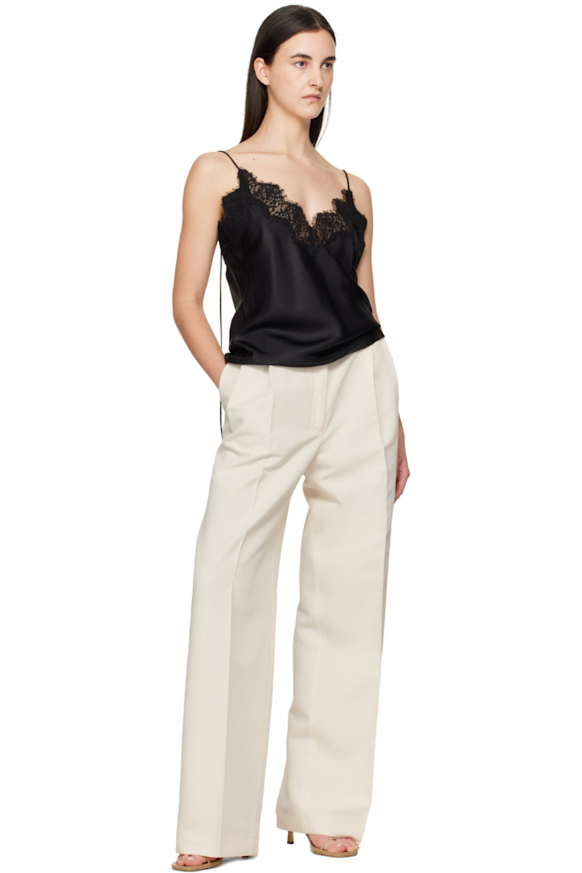 Wide-leg recycled polyester twill trousers. 

· High-rise 
· Belt loops
· Four-pocket styling
· Zip-fly
· Pleats at front
· Creased legs
· Darts at back waistband 
· Partial viscose twill lining

Supplier color: Off white
