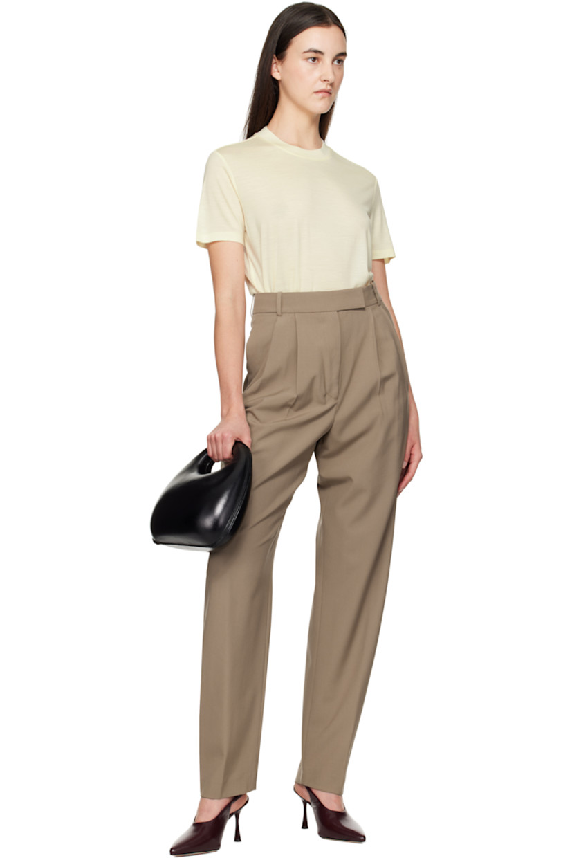 Relaxed-fit virgin wool broadcloth trousers. 

· High-rise
· Belt loops
· Four-pocket styling
· Zip-fly
· Pleats at front
· Creased legs
· Curved outseams
· Darts at back waistband 

Supplier color: Khaki