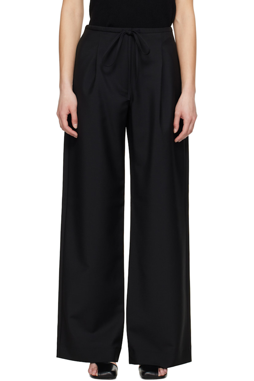 Loose-fit and wide-leg virgin wool- and mohair-blend hopsack trousers.

· Drawstring at waistband
· Four-pocket styling
· Zip fly
· Pleats at front

Supplier color: Black