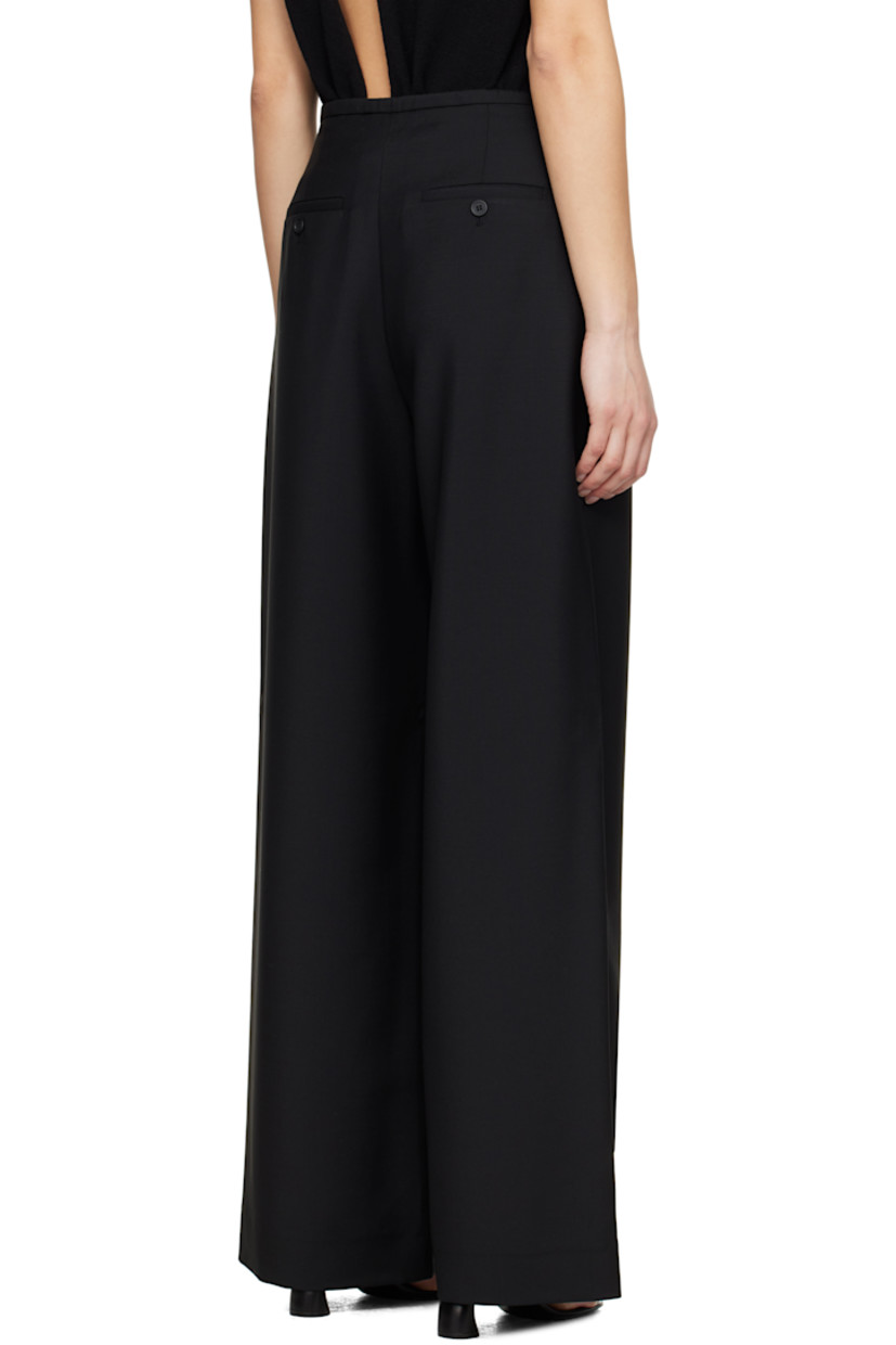 Loose-fit and wide-leg virgin wool- and mohair-blend hopsack trousers.

· Drawstring at waistband
· Four-pocket styling
· Zip fly
· Pleats at front

Supplier color: Black