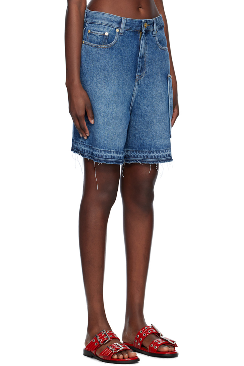 Non-stretch TENCEL™ lyocell denim shorts. Fading throughout. 

· Belt loops
· Five-pocket styling
· Zip fly 
· Frayed cuffs
· Patch pockets at outseam 
· Logo patch at back waistband
· Logo-engraved gold-tone hardware
· Contrast stitching in tan

Supplier color: Mid blue vintage
