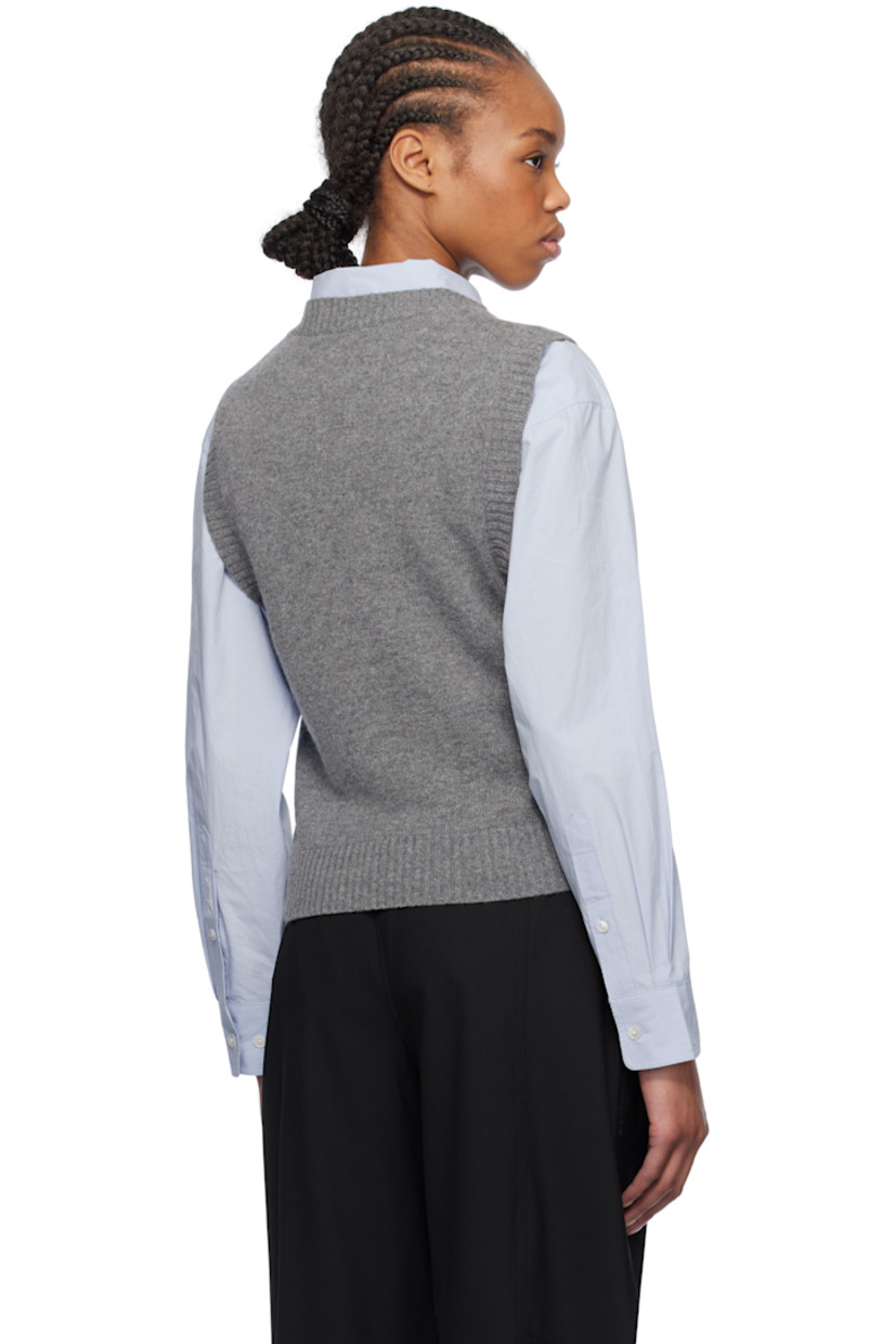 Knit recycled wool- and recycled nylon-blend vest. 

· Rib-knit crewneck, hem, and armscyes
· Jacquard logo and text at front

Supplier color: Frost gray