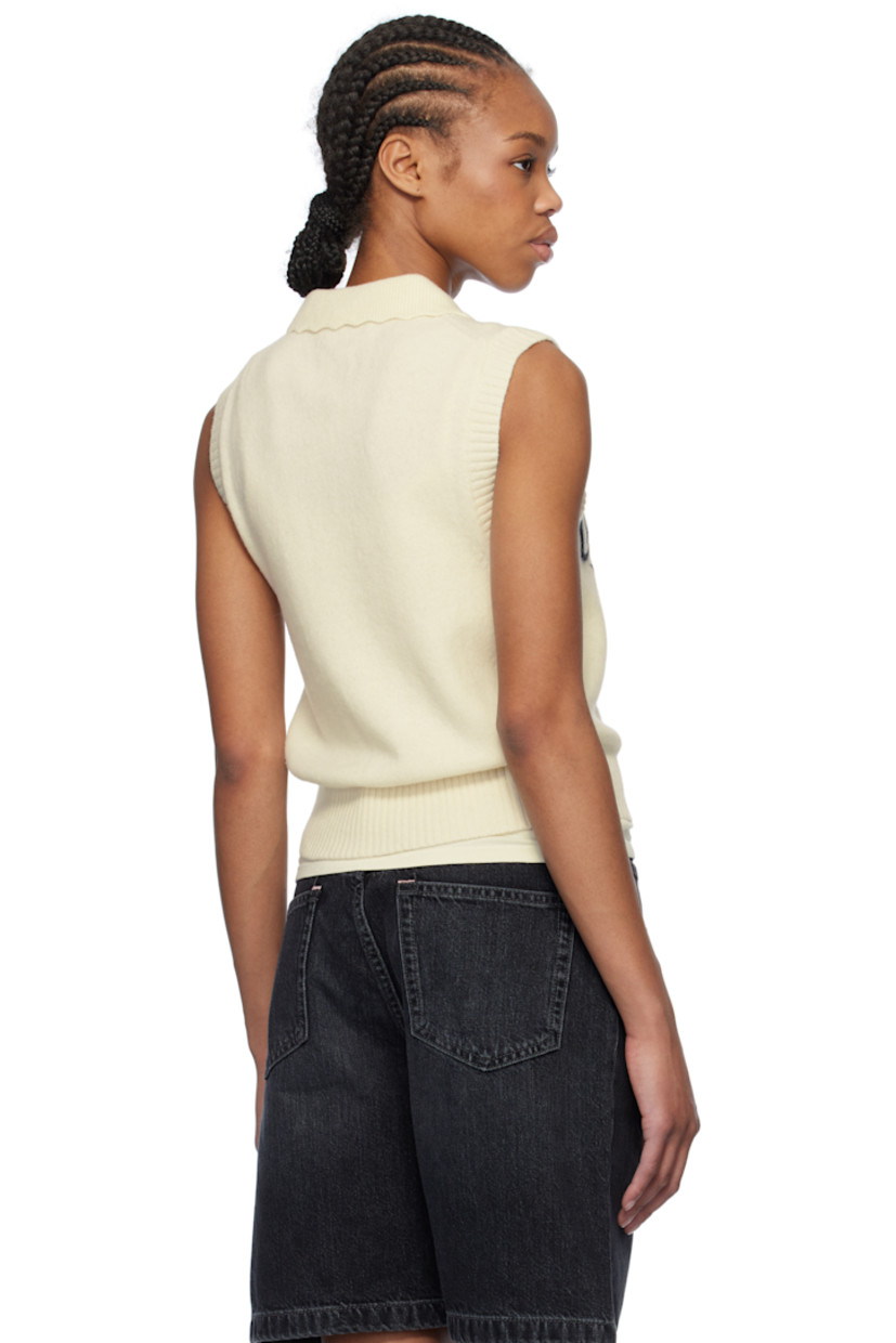 Knit wool- and recycled wool-blend vest. 

· Rib-knit spread collar, hem, and armscyes
· Scalloped edge at collar
· Jacquard logo and text at front

Supplier color: Egret