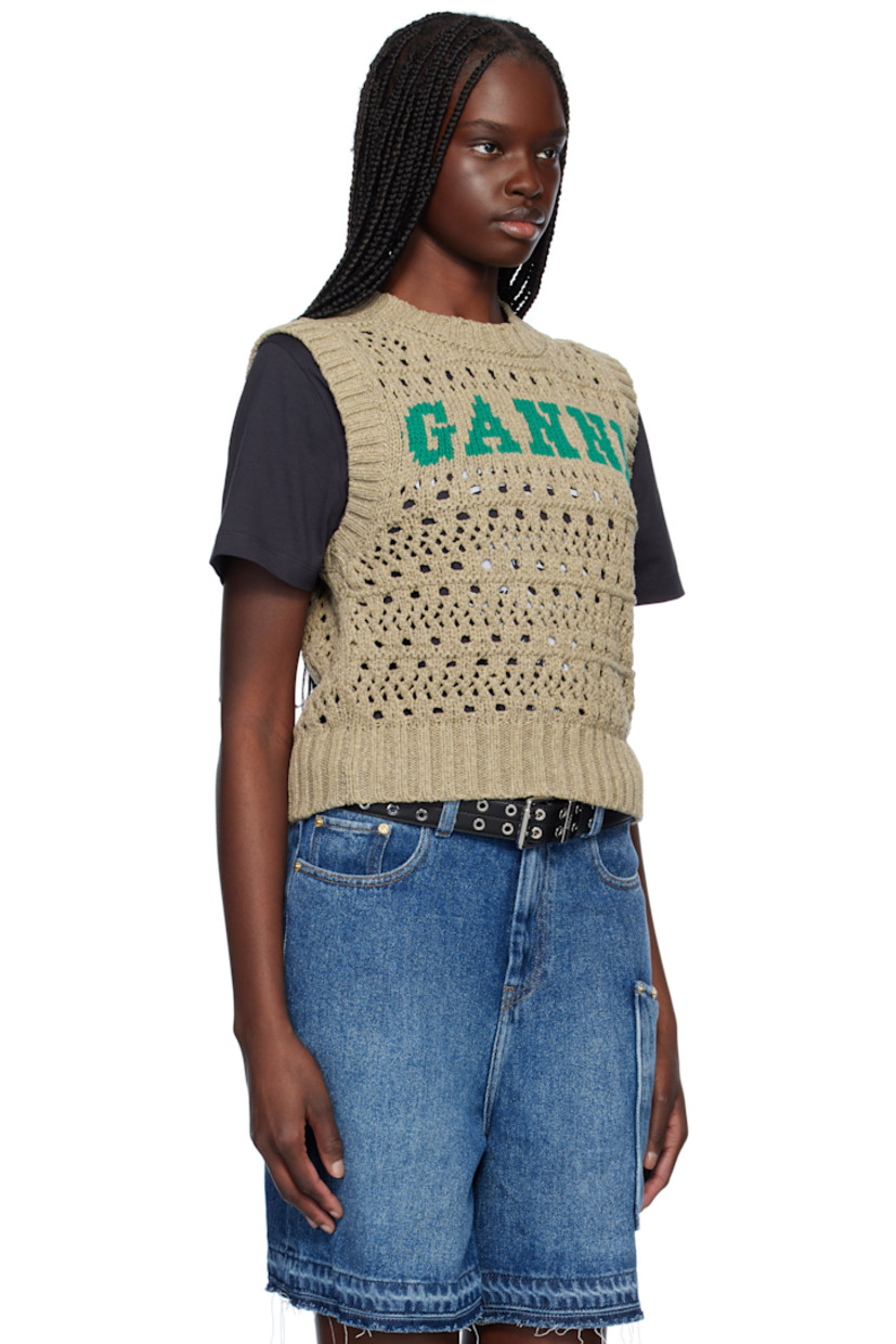 Open-knit recycled cotton- and recycled polyester-blend vest. 

· Rib-knit crewneck, hem, and armscyes
· Intarsia logo at front

Supplier color: Paloma melange