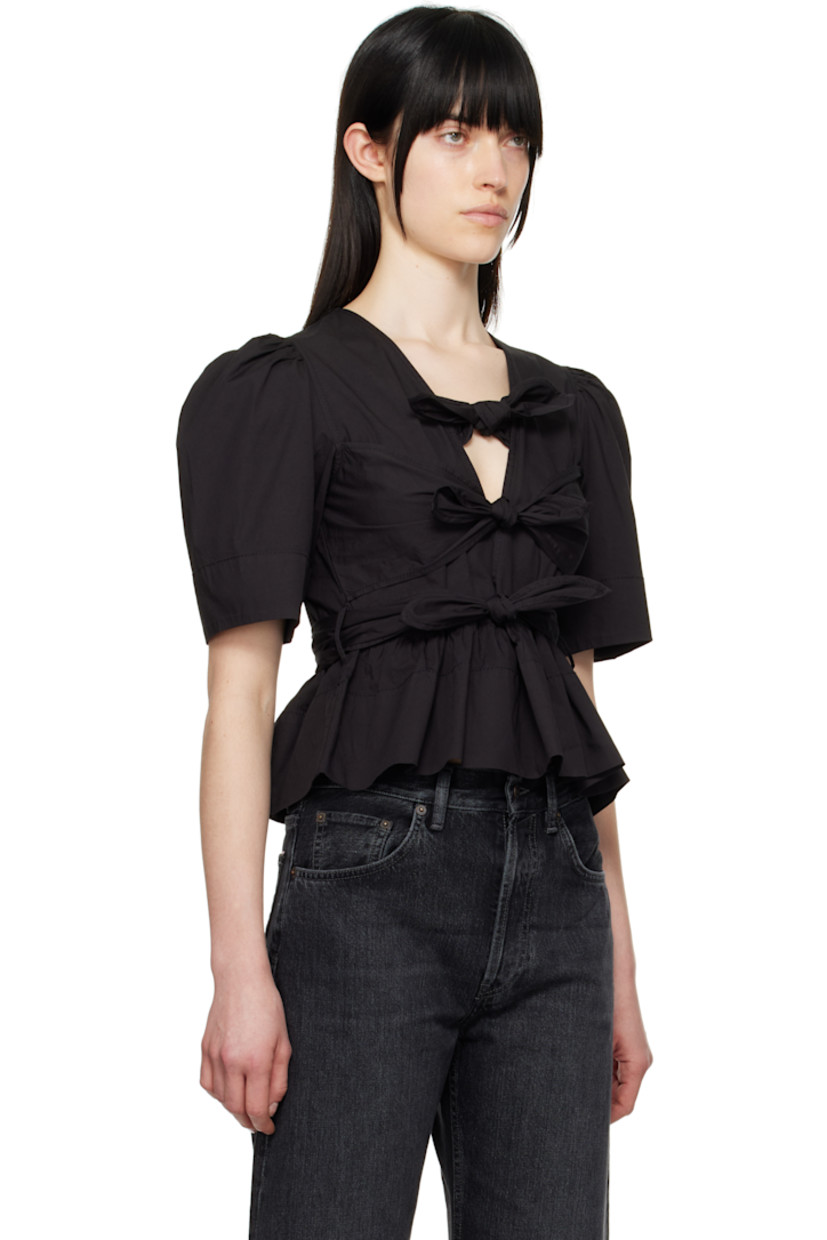 Stretch organic cotton poplin blouse. Gathering throughout.

· Self-tie fastenings at plunging V-neck
· Darts at chest
· Belt loops at waist with detachable self-tie belt
· Peplum hem
· Puff sleeves

Supplier color: Black