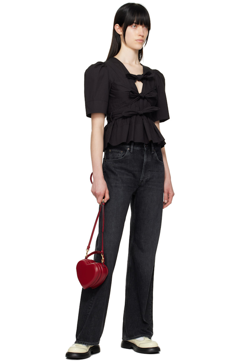 Stretch organic cotton poplin blouse. Gathering throughout.

· Self-tie fastenings at plunging V-neck
· Darts at chest
· Belt loops at waist with detachable self-tie belt
· Peplum hem
· Puff sleeves

Supplier color: Black