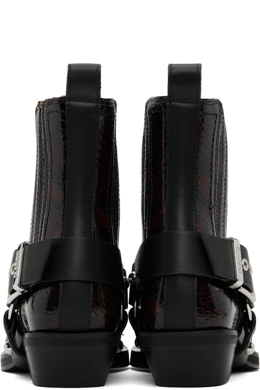 Ankle-high snake-embossed and grained faux-leather boots in burgundy and black.

· Pointed toe
· Detachable harness-style overlay
· Embroidered detailing at vamp
· Logo hardware at vamp
· O-ring and elasticized gusset at sides
· Pin-buckle fastening at outer side
· Pull-loop at heel collar
· Buffed faux-leather lining
· Stacked faux-leather heel with rubber injection
· Rubber sole
· Logo-engraved silver-tone hardware
· Heel: H1.5"

Supplier color: Black/Dark burgundy