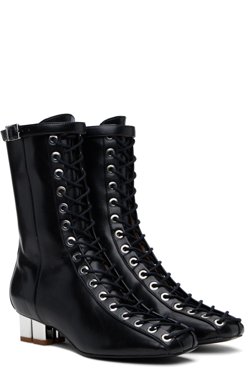 Ankle-high grained Oleatex® faux-leather boots in black.

· Square toe 
· Lace-up closure
· Pin-buckle strap at collar
· Zip closure at inner side
· Silver-tone logo kitten heel 
· Faux-leather sole with rubber injections
· Logo-engraved silver-tone hardware
· Heel: H1.5"

Supplier color: Black