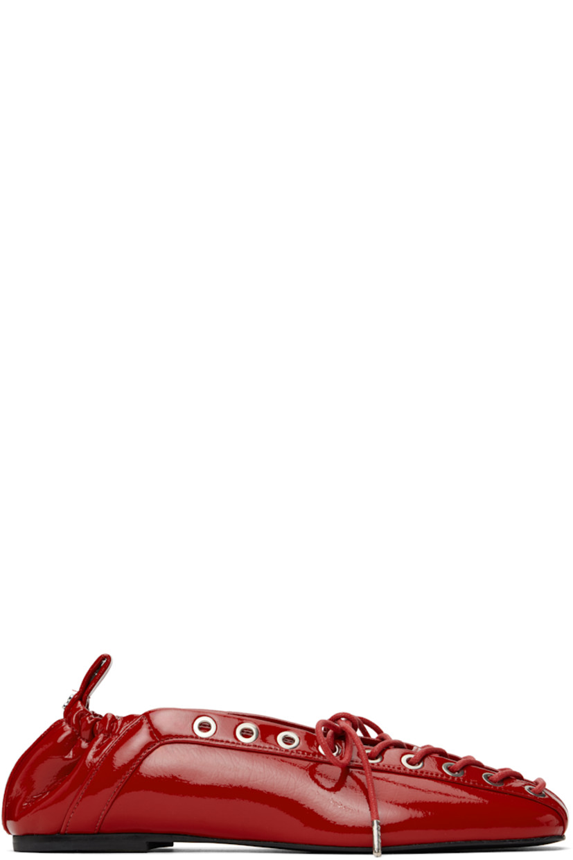 Patent faux-leather ballerina flats in red.

· Square toe
· Lace-up closure
· Metal eyelets at collar
· Pull-loop with logo hardware at elasticized heel collar
· Buffed faux-leather lining
· Polished faux-leather sole with rubber injections
· Silver-tone hardware

Supplier color: Racing red