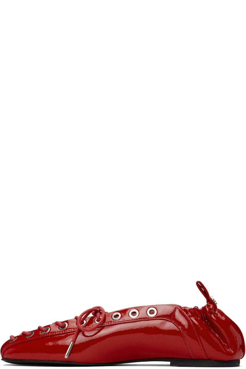Patent faux-leather ballerina flats in red.

· Square toe
· Lace-up closure
· Metal eyelets at collar
· Pull-loop with logo hardware at elasticized heel collar
· Buffed faux-leather lining
· Polished faux-leather sole with rubber injections
· Silver-tone hardware

Supplier color: Racing red