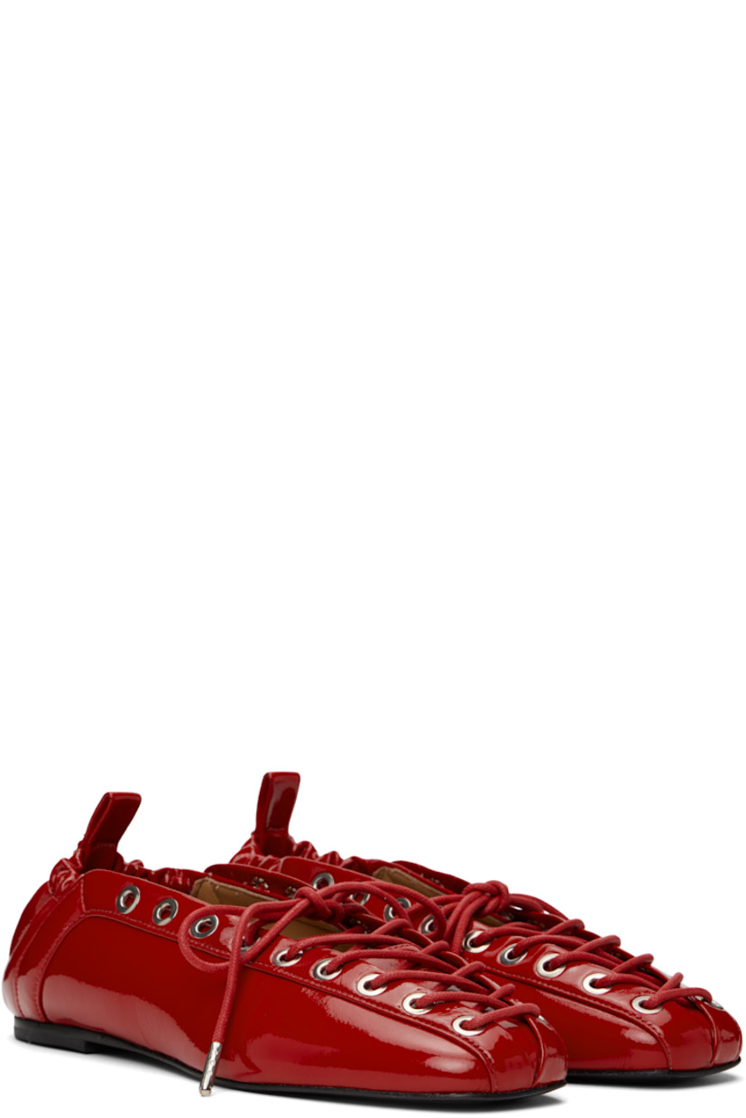 Patent faux-leather ballerina flats in red.

· Square toe
· Lace-up closure
· Metal eyelets at collar
· Pull-loop with logo hardware at elasticized heel collar
· Buffed faux-leather lining
· Polished faux-leather sole with rubber injections
· Silver-tone hardware

Supplier color: Racing red