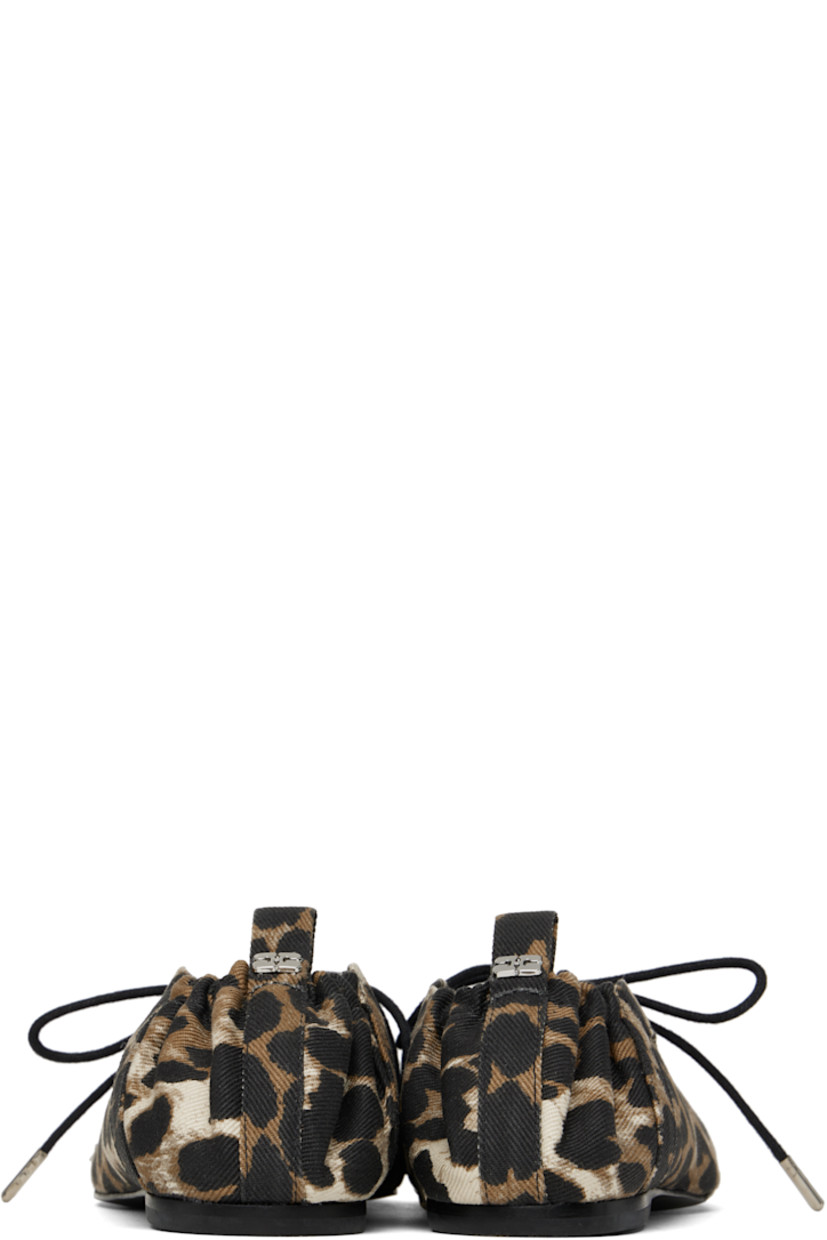 Denim ballerina flats in brown tones.

· GOTS-certified organic cotton
· Leopard pattern printed throughout
· Square toe
· Lace-up closure
· Metal eyelets at collar
· Pull-loop with logo hardware at elasticized heel collar
· Buffed faux-leather lining
· Polished faux-leather sole with rubber injections
· Silver-tone hardware

Supplier color: Leopard