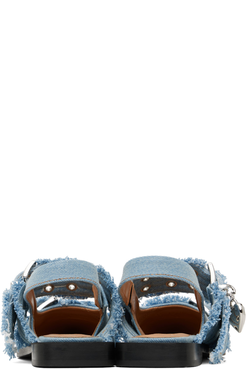 Handcrafted recycled cotton denim flats in blue.

· GRS-certified recycled cotton
· Fading and frayed edges throughout
· Pointed toe
· Pin-buckle straps at vamp
· Detachable graphic charm at outer side
· Partially elasticized slingback strap
· Buffed faux-leather lining
· Padded footbed
· Rubber sole
· Logo-engraved silver-tone hardware
· Contrast stitching in tan

Supplier color: Faded denim
