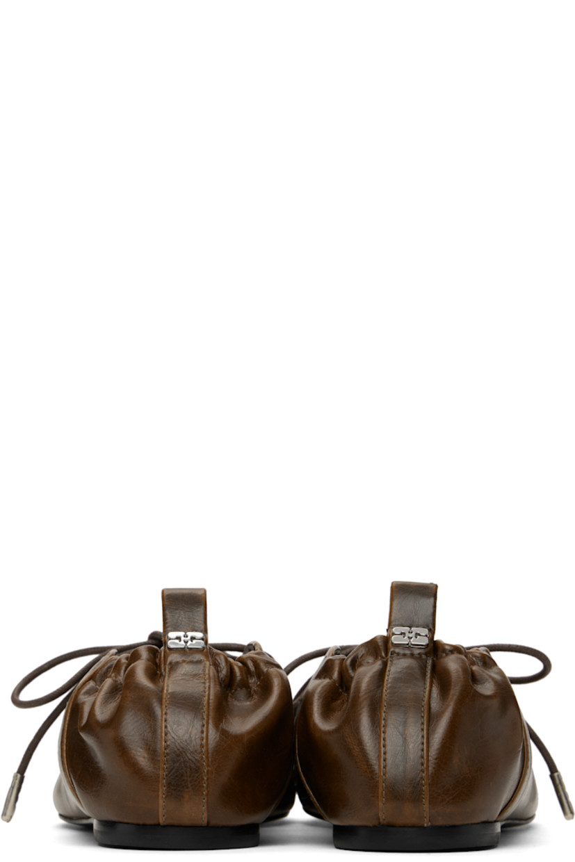 Crinkled Oleatex® faux-leather ballerina flats in khaki.

· Fading throughout
· Square toe
· Lace-up closure
· Metal eyelets at collar
· Pull-loop with logo hardware at elasticized heel collar
· Buffed faux-leather lining
· Polished faux-leather sole with rubber injections
· Silver-tone hardware

Supplier color: Dark olive