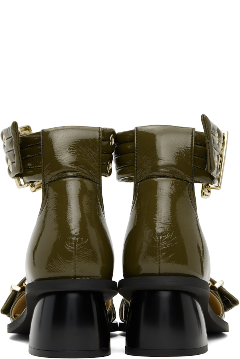 Patent faux-leather heels in khaki.

· Pointed toe
· Pin-buckle strap at vamp
· Pin-buckle ankle strap
· Logo embossed at padded footbed
· Covered block heel with rubber injection
· Rubber sole
· Logo-engraved gold-tone hardware
· Heel: H2"

Supplier color: Military olive