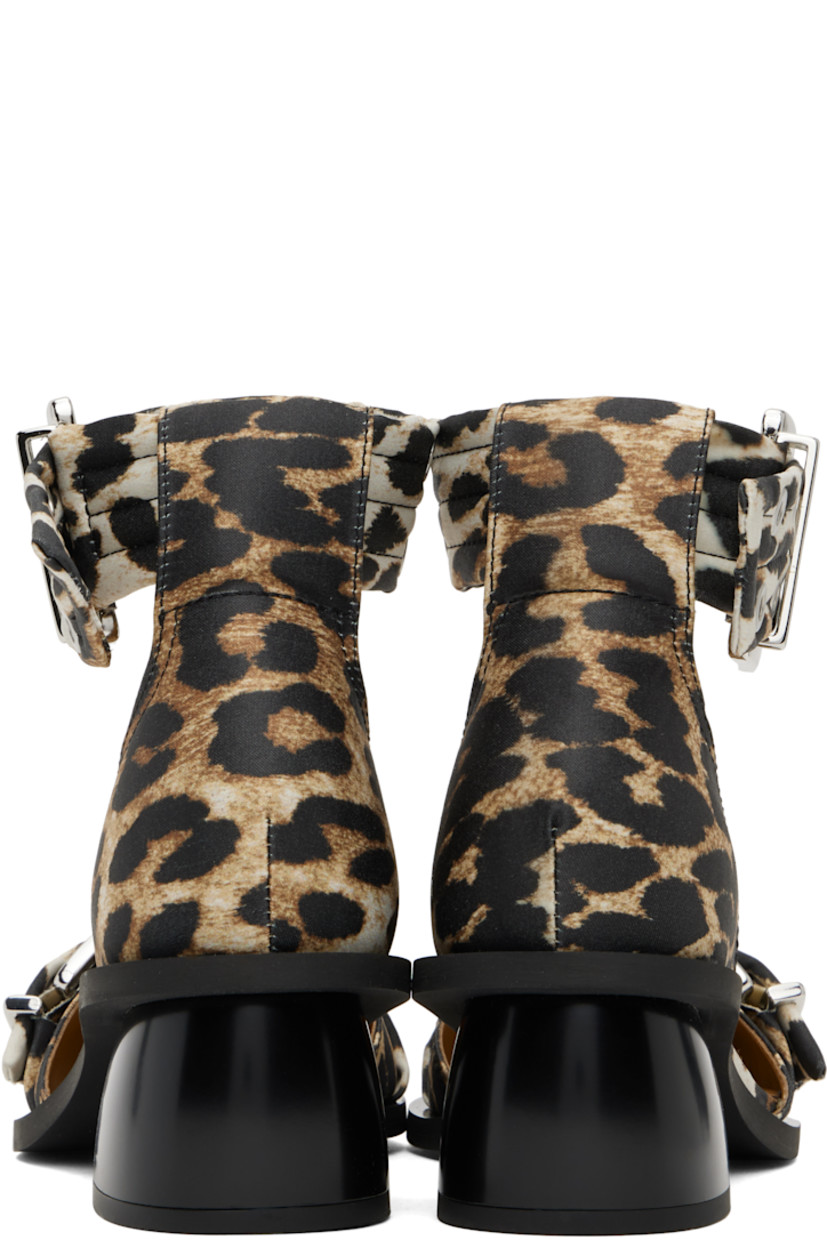 Satin heels in tan and black. 

· Leopard pattern throughout
· Pointed toe
· Pin-buckle strap at vamp
· Pin-buckle ankle strap
· Logo embossed at padded footbed
· Covered block heel with rubber injection
· Rubber sole
· Logo-engraved silver-tone hardware
· Heel: H2"

Supplier color: Leopard