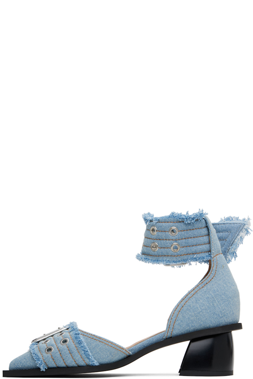 Recycled cotton denim heels in blue. 

· Frayed edges throughout
· Pointed toe
· Pin-buckle strap at vamp
· Pin-buckle ankle strap
· Buffed faux-leather lining
· Covered block heel with rubber injection
· Rubber sole
· Contrast stitching in tan
· Heel: H1.75"

Supplier color: Faded denim