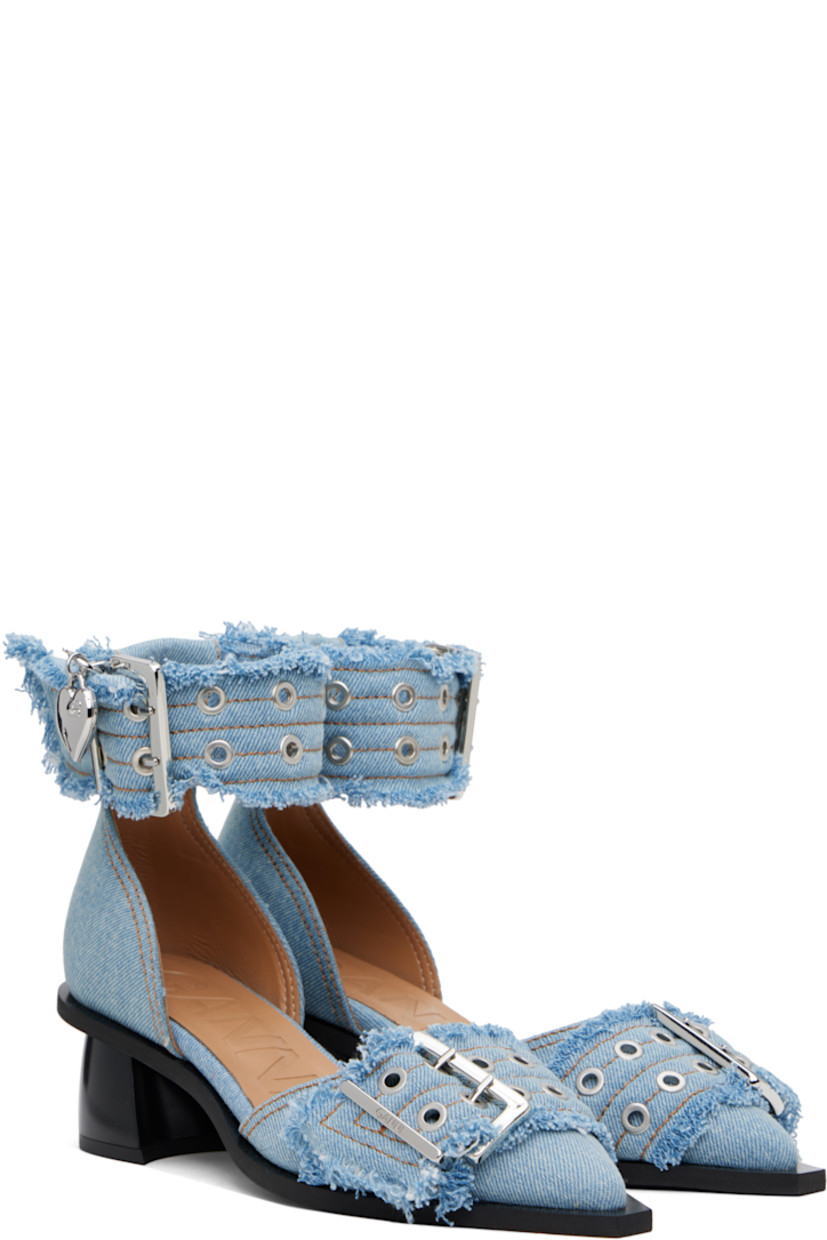Recycled cotton denim heels in blue. 

· Frayed edges throughout
· Pointed toe
· Pin-buckle strap at vamp
· Pin-buckle ankle strap
· Buffed faux-leather lining
· Covered block heel with rubber injection
· Rubber sole
· Contrast stitching in tan
· Heel: H1.75"

Supplier color: Faded denim