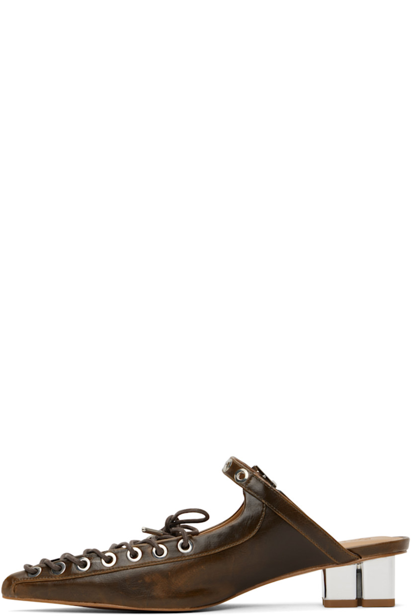 Crinkled Oleatex® faux-leather mules in brown. 

· Fading throughout
· Pointed toe
· Lace-up closure 
· Pin-buckle strap at vamp
· Logo embossed at padded faux-leather footbed
· Logo graphic heel with rubber injection 
· Faux-leather sole with rubber injection
· Logo-engraved silver-tone hardware
· Heel: H1.5"

Supplier color: Dark olive