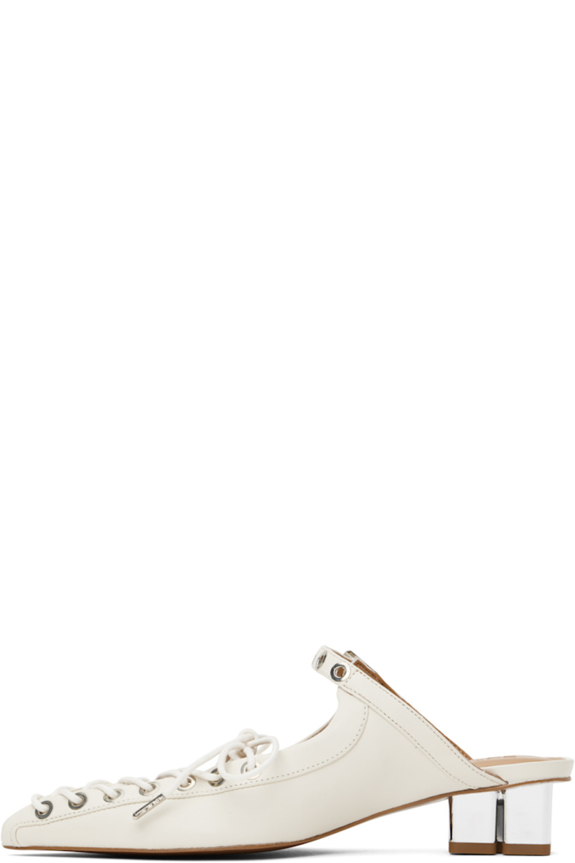 Grained Pélinova® faux-leather mules in off-white. 

· Pointed toe
· Lace-up closure 
· Pin-buckle strap at vamp
· Logo embossed at padded faux-leather footbed
· Logo graphic heel with rubber injection 
· Faux-leather sole with rubber injection
· Logo-engraved silver-tone hardware
· Heel: H1.5"

Supplier color: Egret