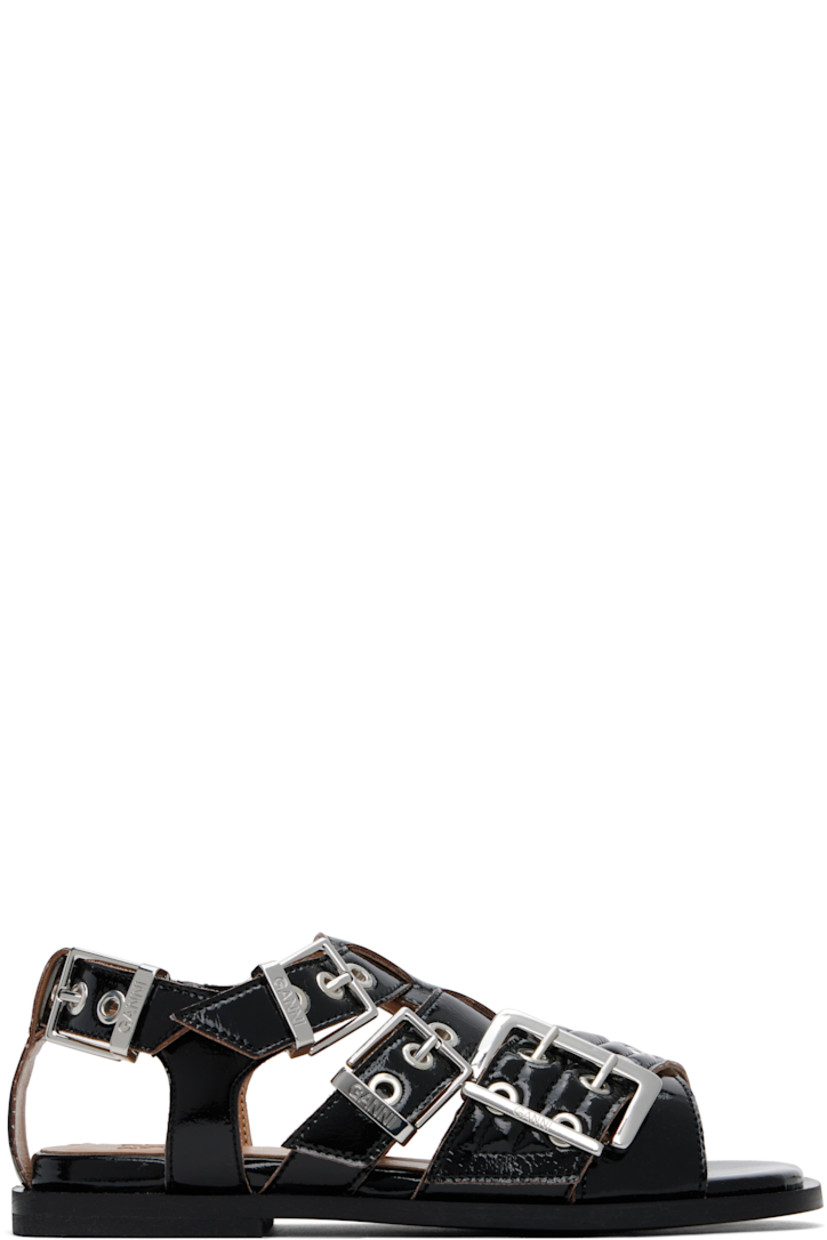 Patent faux-leather flat sandals in black.

· Open toe 
· Pin-buckle crisscrossing straps at vamp
· Partially elasticized pin-buckle slingback strap
· Logo embossed at padded footbed
· Buffed faux-leather lining
· Stacked rubber block heel
· Faux-leather sole
· Logo-engraved silver-tone hardware

Supplier color: Black