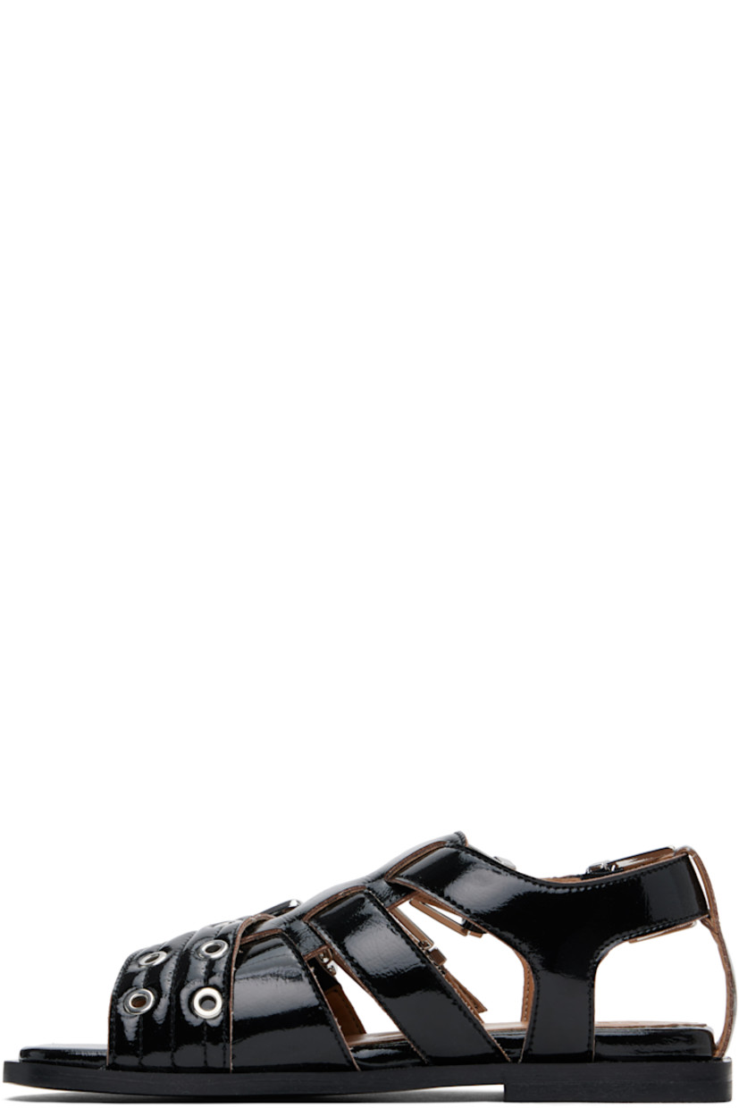 Patent faux-leather flat sandals in black.

· Open toe 
· Pin-buckle crisscrossing straps at vamp
· Partially elasticized pin-buckle slingback strap
· Logo embossed at padded footbed
· Buffed faux-leather lining
· Stacked rubber block heel
· Faux-leather sole
· Logo-engraved silver-tone hardware

Supplier color: Black